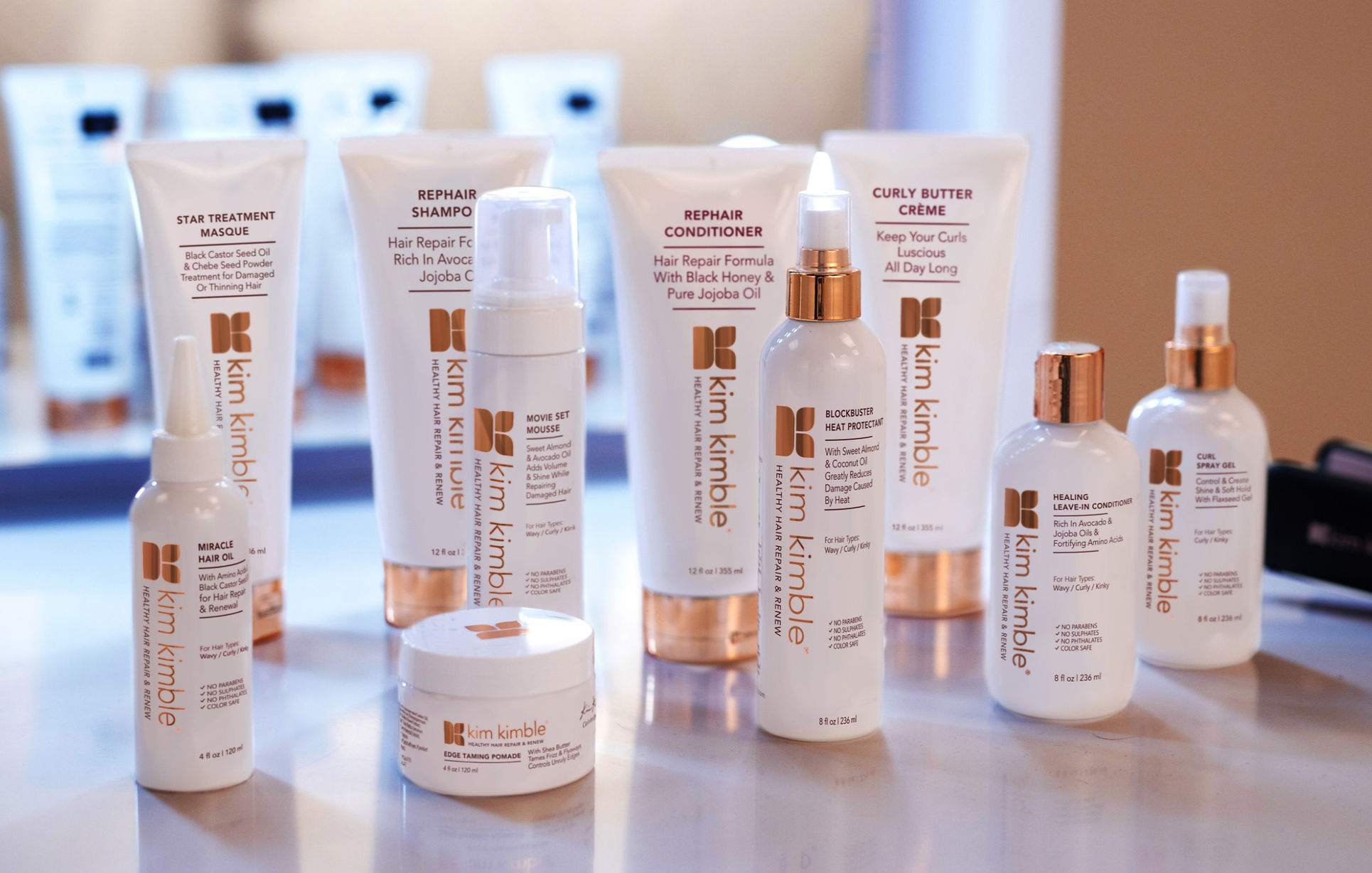 Kim Kimble haircare collection arranged on a table